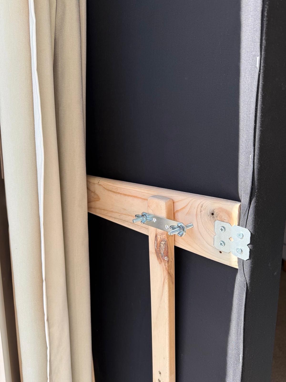Recycled timber frame and mounting bracket inside a panel