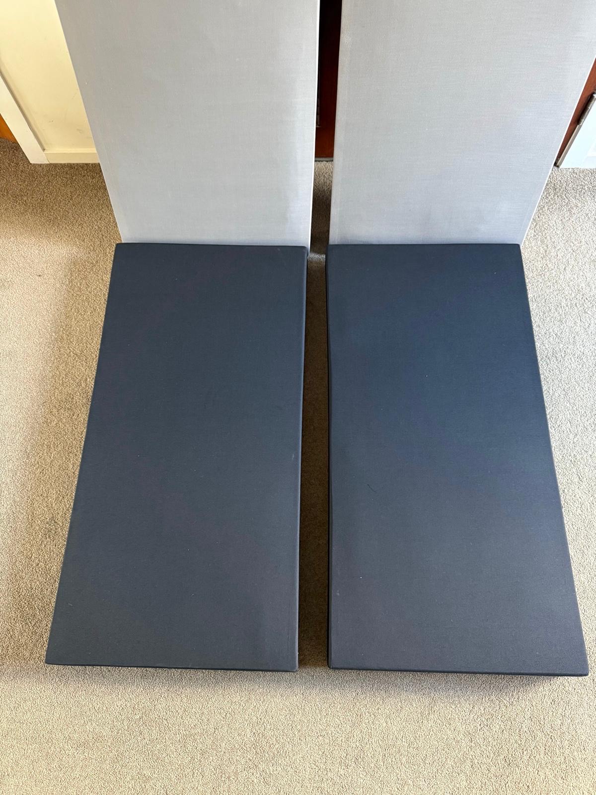 Pair of navy fabric wrapped acoustic panels ready for install